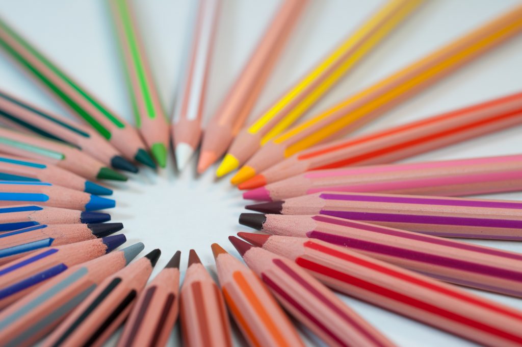 Colored pencils arranged with their tips forming a circle